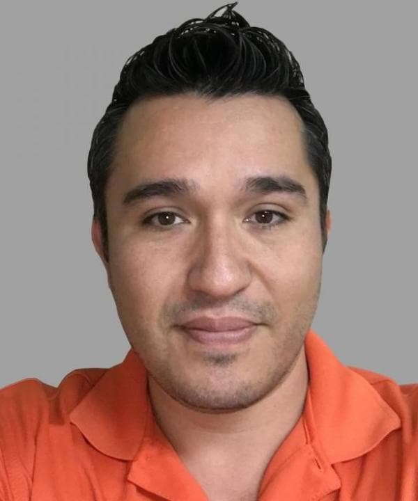 Stampede technician wearing an orange polo shirt.